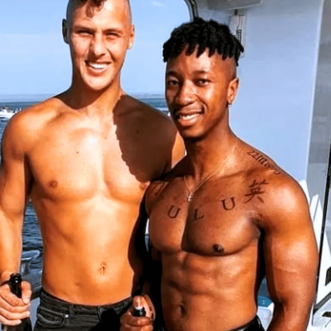 Two topless waiters on a boat